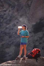 Backpacker taking a drink; Size=180 pixels wide